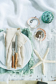 Maritime table decoration with starfish, fishing ball and shells