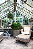 Comfortable seating area in greenhouse