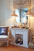 Faux fireplace with wintry accessories and mirror