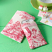 Hand-sewn mobile phone case made from red-and-white toile-de-jouy fabric