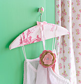 Clothes hanger covered with toile-de-jouy fabric and fabric flower