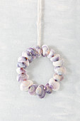 Wreath of lilac and white seashells