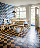Corner bench in tiled kitchen-dining room