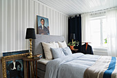 Classic, masculine bedroom with striped wallpaper
