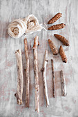 Craft materials for natural decorations: branches, fir cones and wool