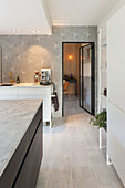 Modern kitchen with geometric wallpaper pattern and kitchen island