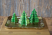 Festive arrangement of handmade paper Christmas trees made from sheet music