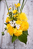 Spring posy of dandelions, buttercups, lady's smock, cleavers and grasses