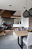 Grey and white, open-plan interior in modern, country-house style