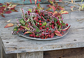 Wreath of hawthorn berries, ling and leafy branches