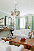 Mint-green walls and curtains in classic living room