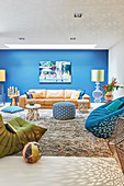 Comfortable seating in living room with blue accent wall