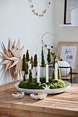 DIY Advent wreath with miniature trees made of moss