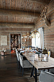 Set table in dining room of elegant log cabin