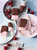 Cherry ice cream pops with chocolate glaze