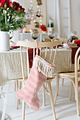 Christmas stockings hung from chair backs