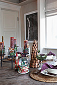 Snowstorm and other Christmas decorations on set table