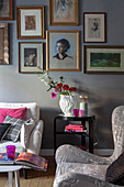 Pink accents of colour in classic living room in shades of grey