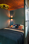 Double bed in bedroom with sliding door
