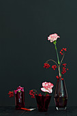 Modern arrangement of carnations and berries