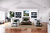 Open living room with upholstered set, side tables, coffee table and white living room cupboard