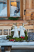 Wintry arrangement of handmade angels and natural materials