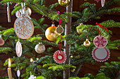 Handmade Christmas-tree decorations and golden baubles