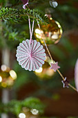 Christmas-tree decoration handmade from paper and yarn