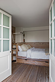 Wooden bed in guest room