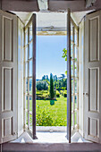 View through open French doors into the garden