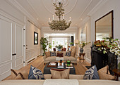 Elegant living room with panelled walls and stucco ceiling