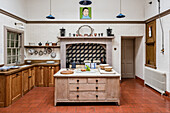 Large classic English-style country kitchen with terracotta tiles