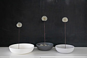 Dandelions in bowls as table decoration