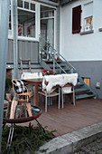 Winter terrace with a fire pit, and sheepskin