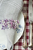 Napkin ring made from strings of lilac florets