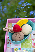 Handmade felt ice-cream and fruit on tray