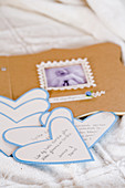 birth announcement thank you cards from a baby shower on heart-shaped paper