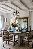 Dining room with Gustavian dining table and Georgian-style mirror