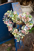 Heart wreath of hydrangea blossoms and snowberries
