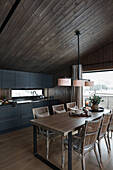 Open kitchen and dining area in the wooden house