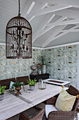 Birdcage lampshade above dining table