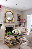 Vintage coffee table and French-style sofa with gold mirror