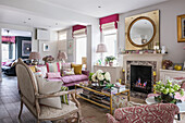 French-style, vintage coffee table and sofa in open-plan interior