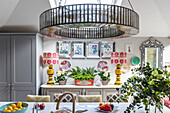 Striking Downton chandelier above breakfast bar with upcycled seating