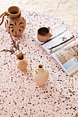 Ceramic jugs on terrazzo coffee table