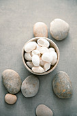 Natural massage stones with magnolia flowers