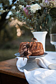 Bundt cake on garden table with linen tablecloth