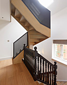 Staircase with old, turned banister spindles and modern balustrade