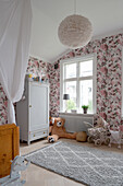 Nostalgic children's room in white with floral wallpaper