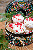 Gingerbread muffins with cream-cheese frosting and redcurrants